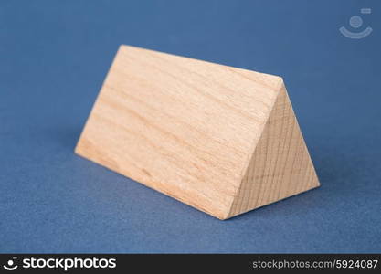 wooden geometric shapes on a blue background