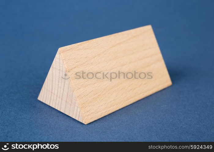 wooden geometric shapes on a blue background