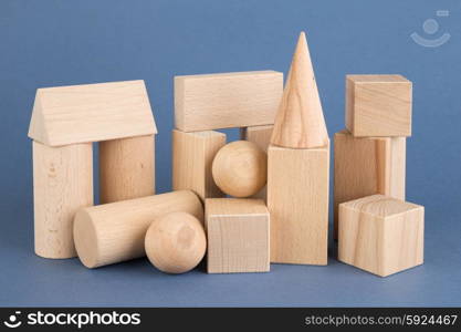 wooden geometric shapes on a blue background