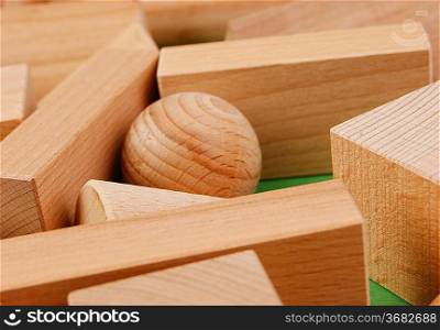 wooden geometric shapes on a green background