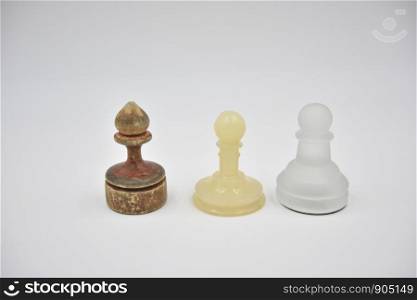 wooden, glass and plastic ponces on white background