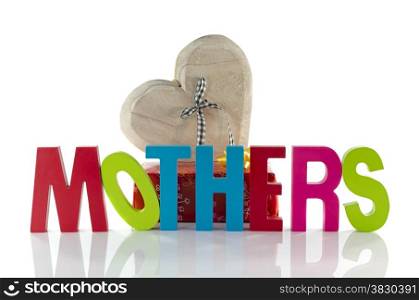 wooden heart and red present with mothers day text in blue and green