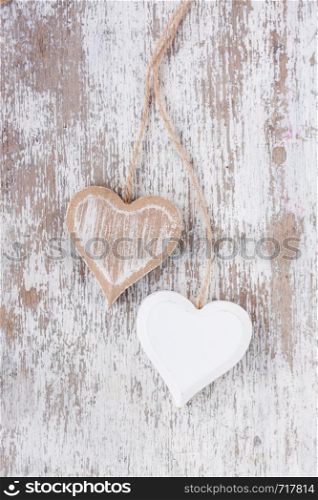 Wooden heart on a white wooden background