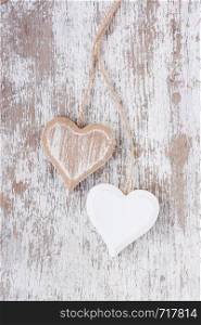Wooden heart on a white wooden background