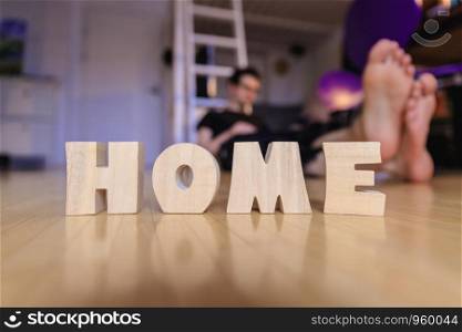 Wooden HOME Letters on the floor of an apartment