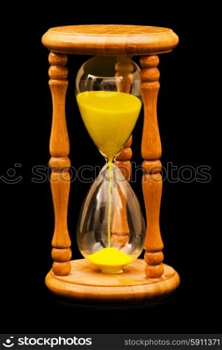 Wooden hourglass isolated on the balck background