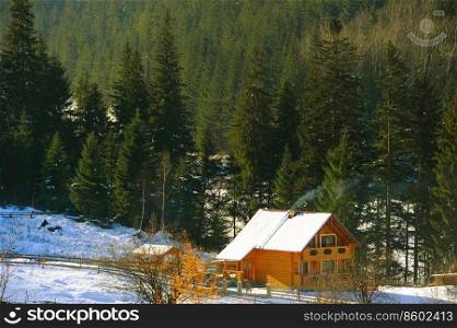Wooden house in Carpathians mountains in the winter. Ukraine
