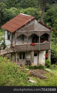 Wooden house in green in the country in Tbilisi