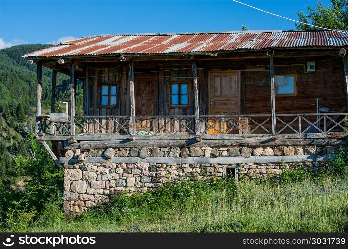 Wooden house in the country . Wooden house in green in the country in Turkey