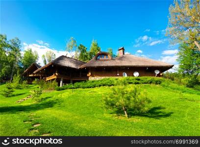 Wooden house in the forest in summer