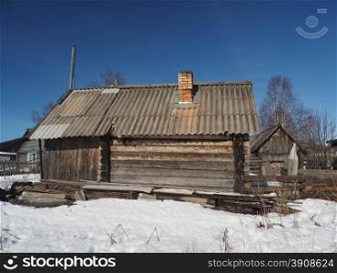 Wooden house in winter village