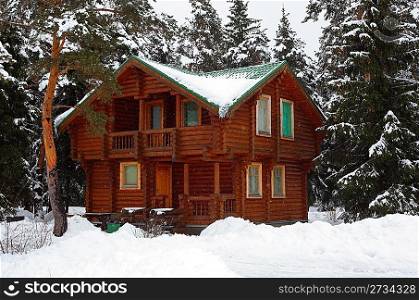 Wooden house in winter wood