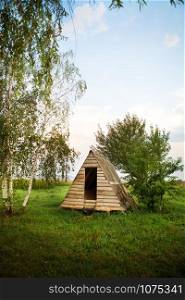 wooden house near the lake in the form of a triangle, the perfect holiday.. wooden house near the lake in the form of a triangle, the perfect holiday