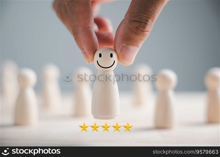 Wooden human figure firmly grasped by man hand. HR officer looks for leader and CEO. Leader breaks free from the crowd. Personal development, motivation, challenge. HR, HRM, HRD concepts.