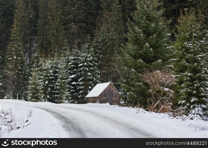 Wooden hut in the mountains in winter