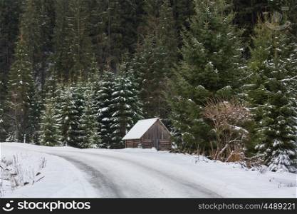Wooden hut in the mountains in winter