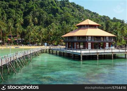 Wooden jetty on exotic beach on the island, Thailand