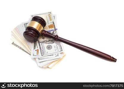 Wooden judge gavel on American money
