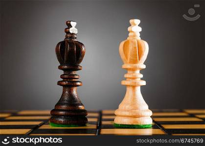 wooden kings on gray background
