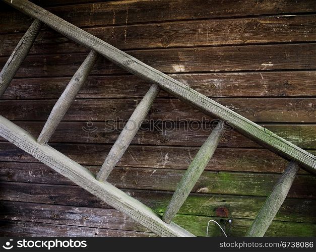 Wooden ladder. old wooden ladder before a cabin