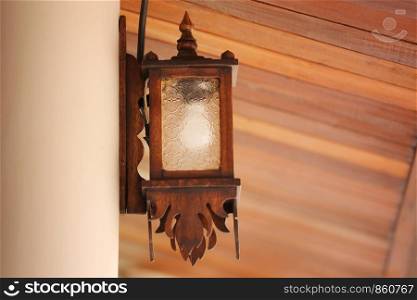 Wooden lamps that are stuck on the wall.