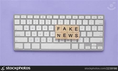 wooden letters forming fake news