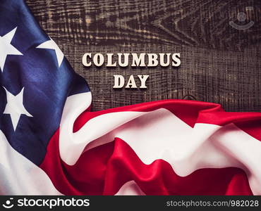 Wooden letters of the alphabet in the form of the words Columbus Day. Top view, close-up. Preparation for the holiday. Beautiful Greeting Card on Columbus Day. Preparation for the holiday