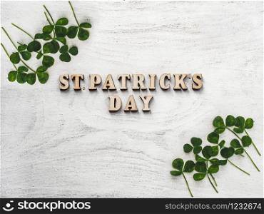 Wooden letters of the alphabet in the form of the words St. Patrick&rsquo;s Day lying on the table. View from above. Isolated background, wooden surface. Congratulations for relatives, friends, colleagues. St. Patrick&rsquo;s Day . Top view. Isolated background