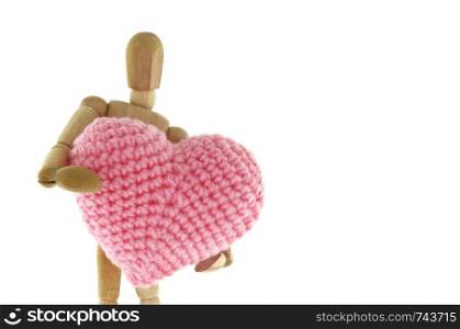 Wooden mannequin hugging heart knit with yarn, isolated on white background