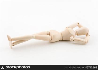 Wooden model dummy in a relaxing posture