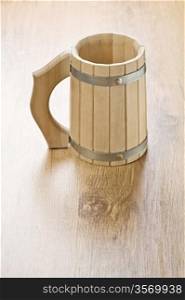wooden mug on wooden background