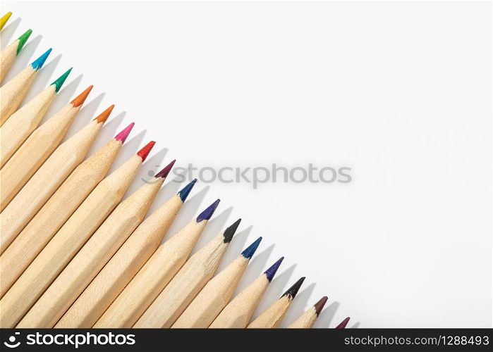 Wooden Multicolored pencils isolated on white background.Top view Copy space