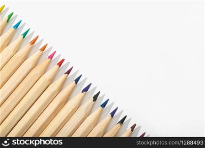 Wooden Multicolored pencils isolated on white background.Top view Copy space