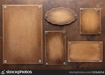 Wooden nameplate or sign board screwed on wall background. Front view of name plate
