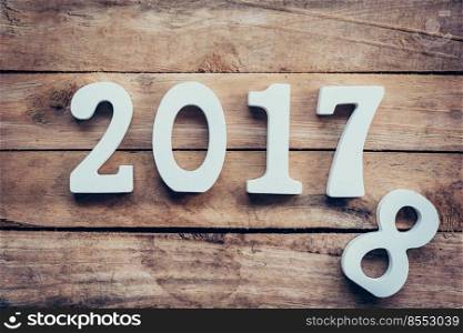 Wooden numbers forming the number 2017, For the new year 2017 on a rustic wooden background.