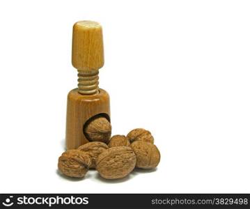 wooden nutcracker isoalted on white with walnuts