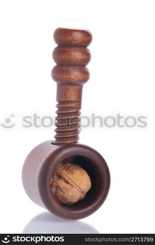 wooden nutcracker with walnut isolated on white background