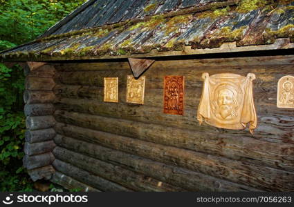 wooden Orthodox Church in the forest in summer. wooden Orthodox Church in the forest in summer, Russia