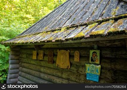 wooden Orthodox Church in the forest in summer. wooden Orthodox Church in the forest in summer, Russia