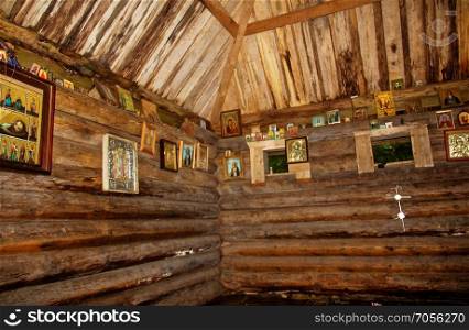 wooden Orthodox Church in the forest in summer. wooden Orthodox Church in the forest in summer, Russia