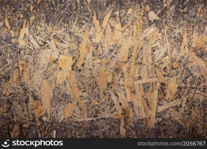 Wooden osb background texture. Wood tabletop top view with copy space. Plank board surface