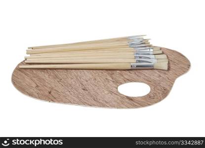 Wooden palette for holding and mixing paint with a variety of paint brushes - path included