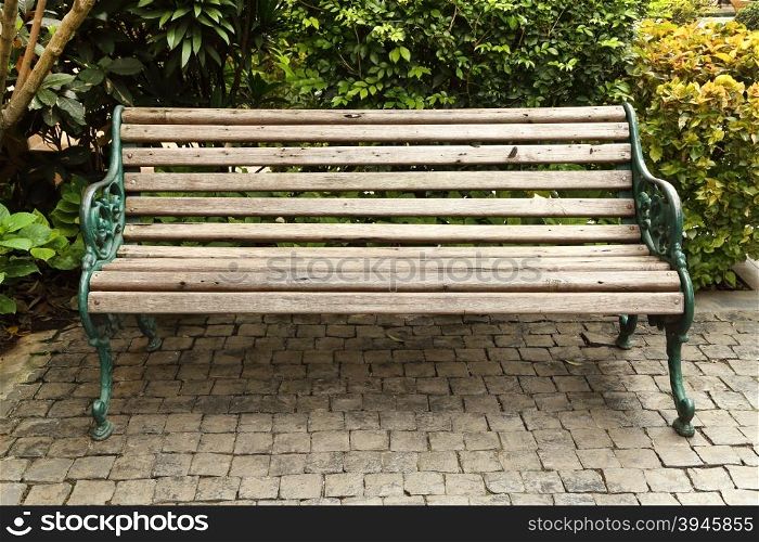 wooden park bench in the garden