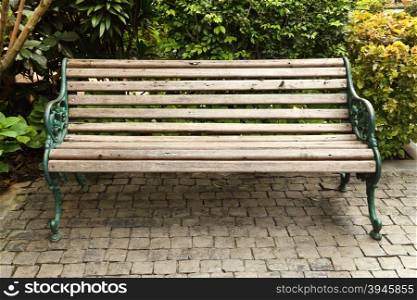 wooden park bench in the garden