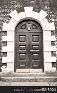 wooden parliament in london old church door and marble antique wall
