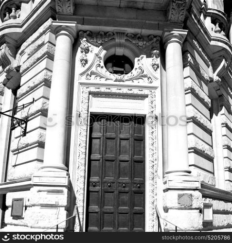 wooden parliament in london old door and marble antique wall