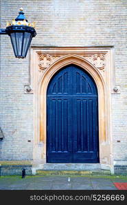 wooden parliament in london old door and marble antique wall