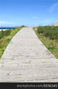 Wooden path leading to a Spanish beach