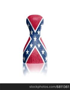 Wooden pawn with a painting of a flag, confederate flag