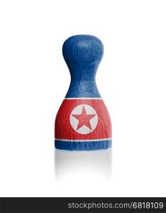 Wooden pawn with a painting of a flag, North Korea